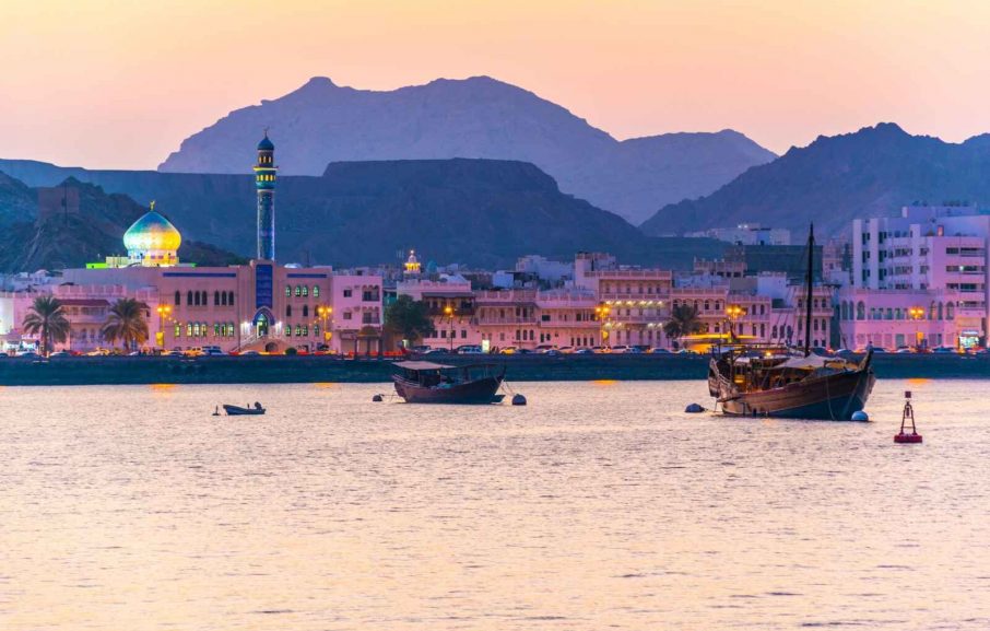 View of coastline of Muttrah district of Muscat during sunset, Oman